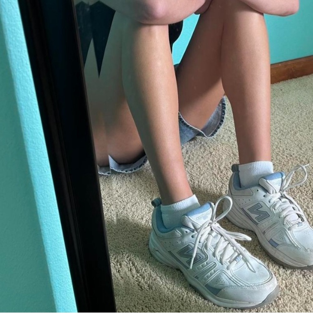 New Balance 409 V2 Cross Training vintage dad sneakers in white and baby blue.